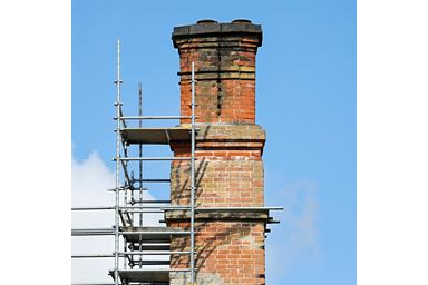 Chimney stack under restoration with scaffolding