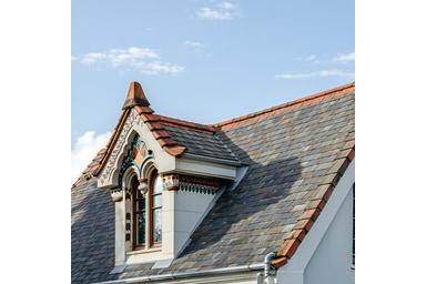 Restored heritage roof with decorative ridge tiles